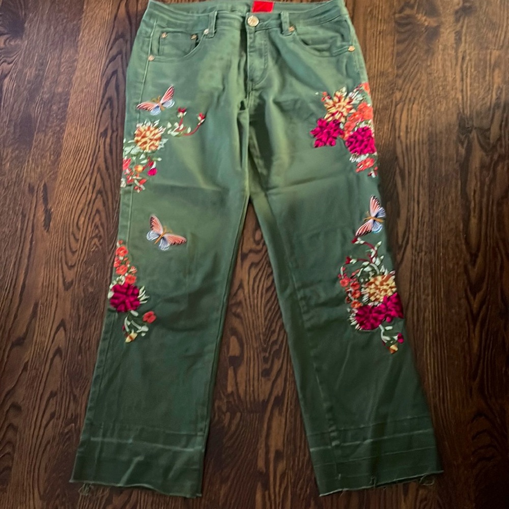 Army green cargo pants w/ colorful stitching.